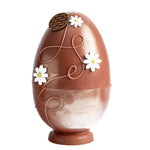 DelRey fondantchocolade paasei afgewerkt met bloemen en opgevuld met pralines / DelRey dark chocolate Easter egg finished with flowers and filled with chocolates.